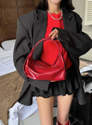 The Conchiglia Leather Crescent Bag