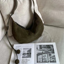 The Mezzaluna Suede Crossbody