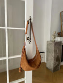 The Mezzaluna Suede Crossbody