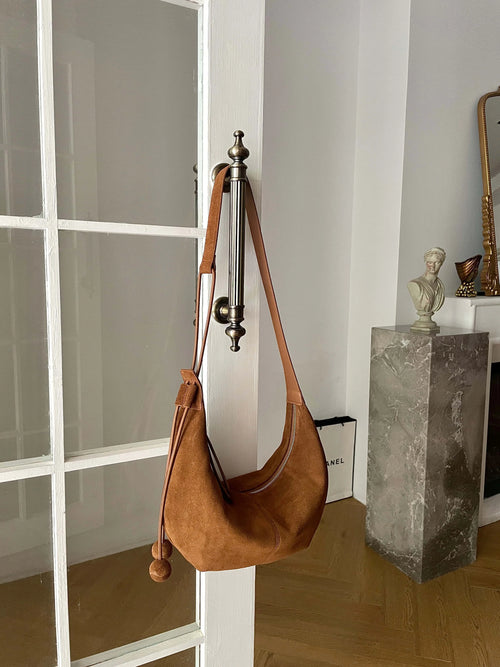 The Mezzaluna Suede Crossbody