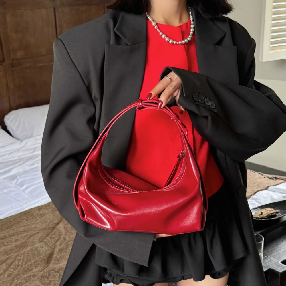The Conchiglia Leather Crescent Bag