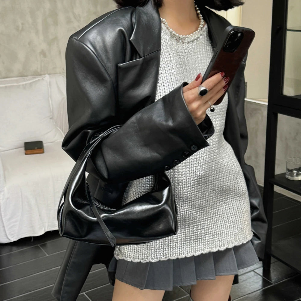 The Conchiglia Leather Crescent Bag
