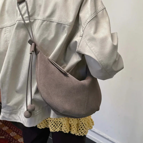 The Mezzaluna Suede Crossbody