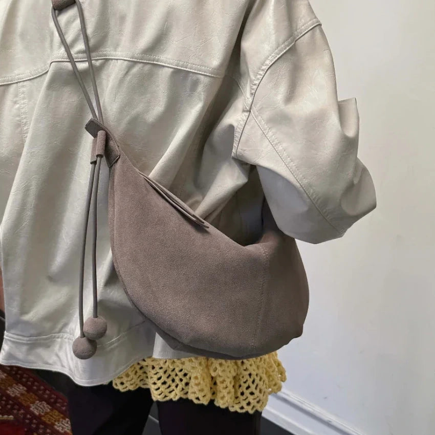 The Mezzaluna Suede Crossbody