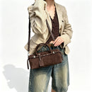 The Cilindro Suede Bowling Bag