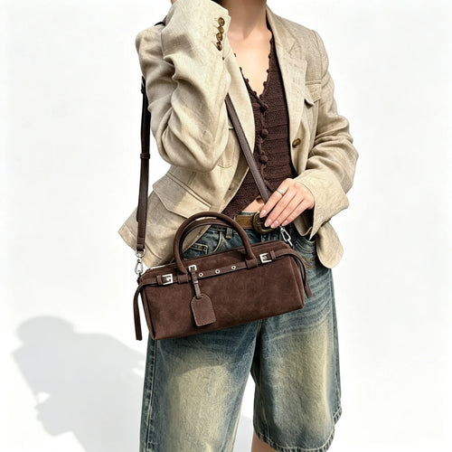 The Cilindro Suede Bowling Bag