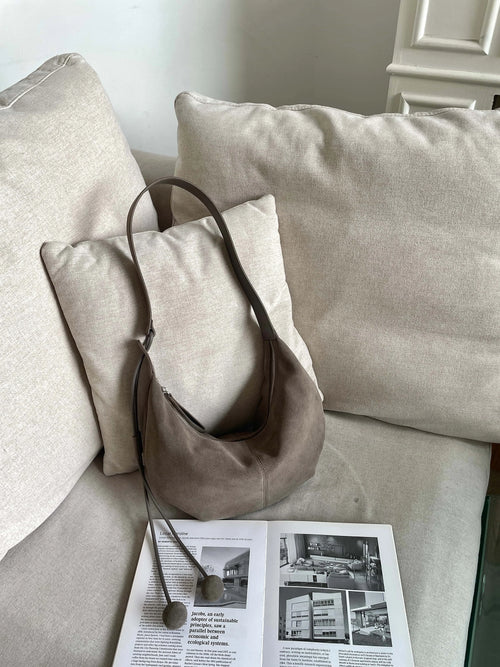 The Mezzaluna Suede Crossbody
