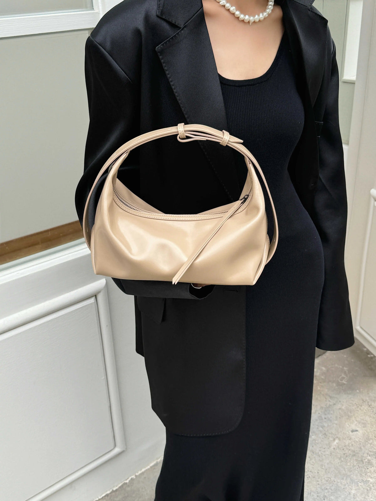 The Conchiglia Leather Crescent Bag