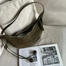 The Mezzaluna Suede Crossbody
