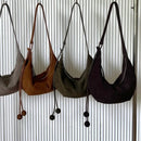 The Mezzaluna Suede Crossbody