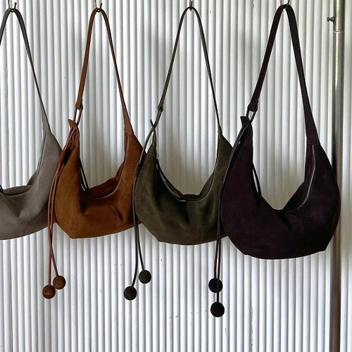 The Mezzaluna Suede Crossbody