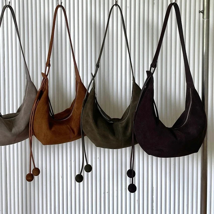 The Mezzaluna Suede Crossbody