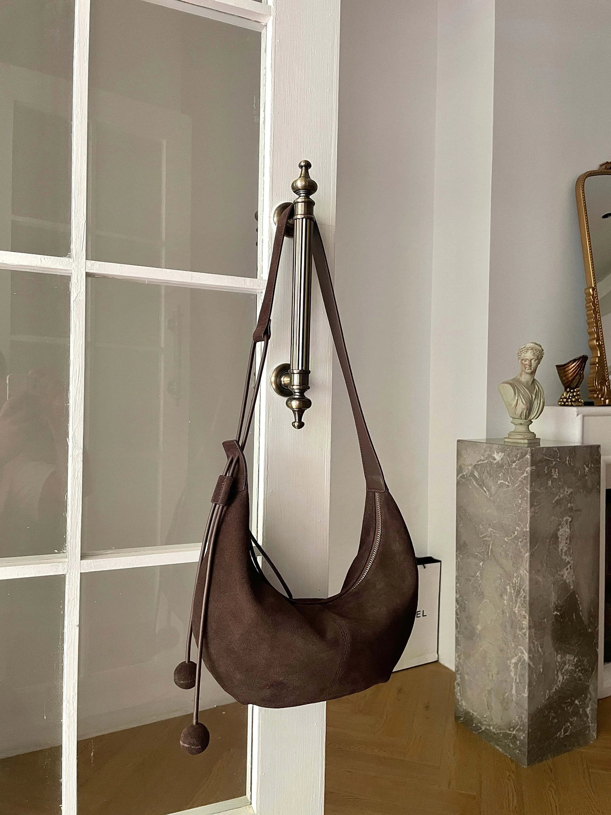 The Mezzaluna Suede Crossbody
